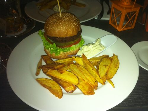 Vegan house burger with vegan mayo and potato wedges at Green Pumpkin in Riga