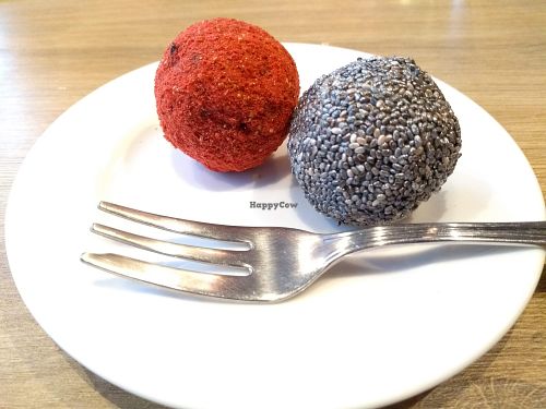 The strawberry power ball with gold dust and the chia power ball with silver coating at Green Pumpkin in Riga