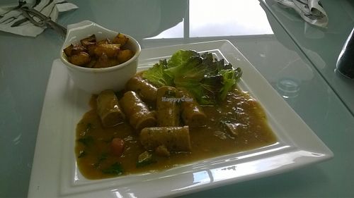 Vegan sausages in gravy with roast potatoes. at GT Organics Cafe in Christchurch