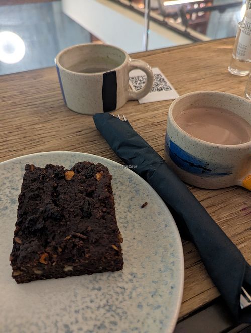 Hot cocoa with oat milk and a vegan brownie at InLoveAgain in Athens