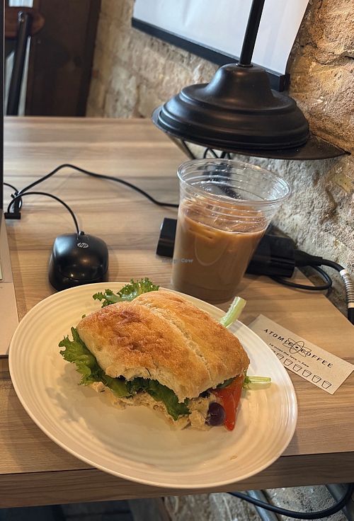 Hummus sandwich and oat milk iced chai latte at Atomic Coffee in Fargo