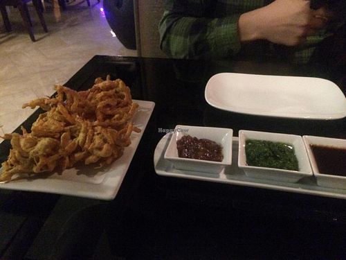 Onion pakoras with chutneys (vegan) at Karma in Sandy