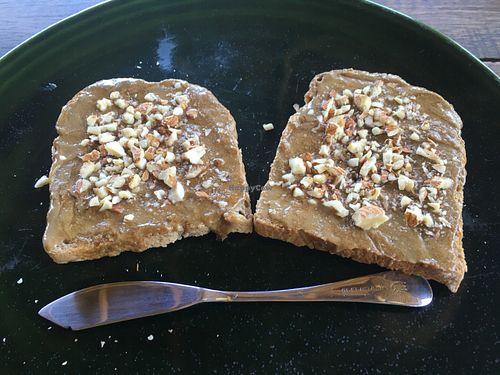 Twoslices brown Rye bread w/tahini,row taco, honey with row nuts and chia seeds at Akasha Home Restaurant in Koh Phangan