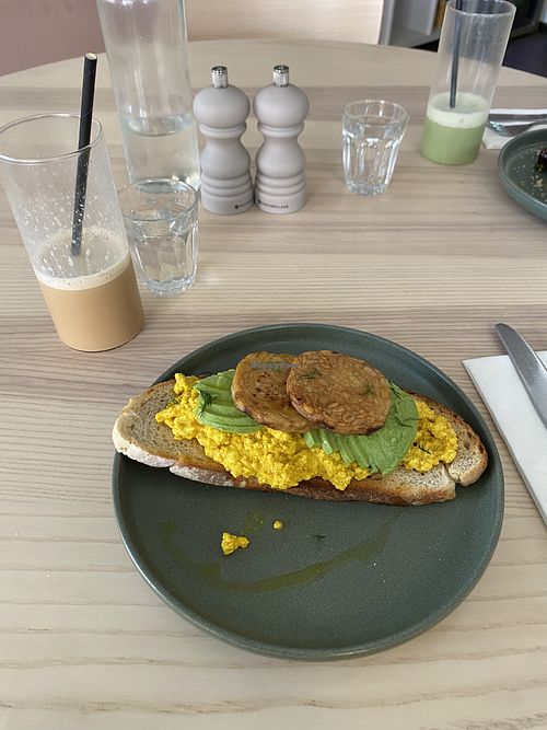 Scramble Tofu, avo & smoked tempeh  at The Lions' Den City Cafe in Norwich