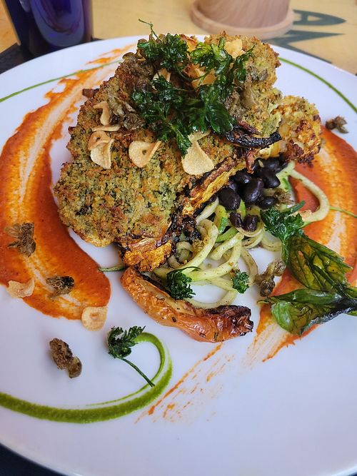 Cauliflower steak. Great flavor, little salty for me. at Yemanja Woodfired Grill in Oranjestad