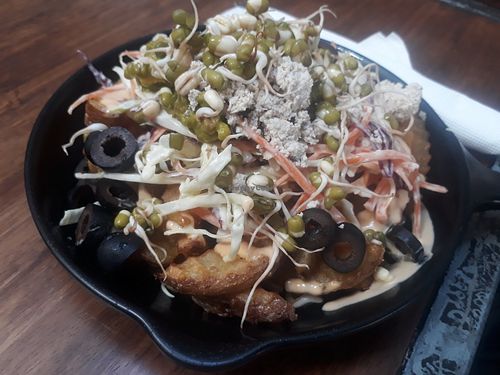 Fries loades with avo 'feta' salad at Eat.Co in Koh Phangan