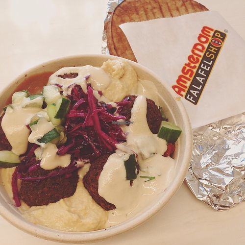 Falafel salad: looks like it's all sauce and hummus but there were more veggies under there, I promise! Pita on the side. at Amsterdam Falafelshop - L'Enfant Plaza in Washington