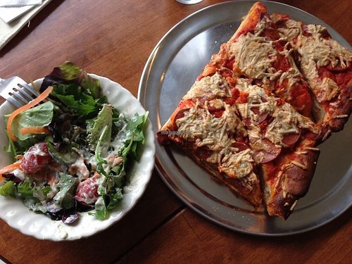 A variety of healthy greens and tasty pizza. at Fortuitea Cafe and Bakery in Washington