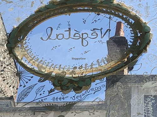 Look under the word 'Végétal" above the restaurant door and you will see "veganage" written both left to right and right to left.  at Un Piano dans la Theiere in Orleans