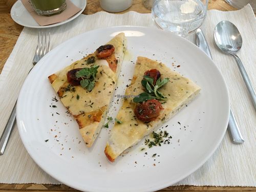 Homemade focaccia with cherry tomatoes and thyme at El Vergel Veggie Restaurant in Tarragona