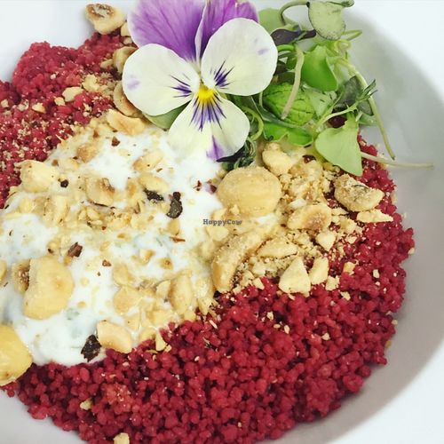 Beetroot couscous with roasted hazelnuts and yogurt sauce with capers  at El Vergel Veggie Restaurant in Tarragona