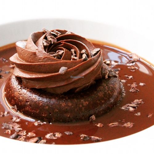 Chocolate and coffee savarin with chocolate sauce and cocoa grué at El Vergel Veggie Restaurant in Tarragona