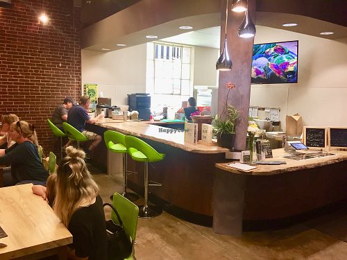 Tables and counter seating areas—very clean and fun at Raw Fresno in Fresno