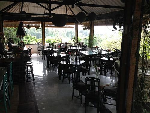 view of restaurant facing the balcony overlooking the rice terraces and ridge at Elephant Cafe in Ubud
