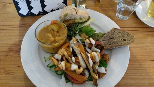 Small vegan tasting platter: half a burger, bread with guacamole, some 'kapsalon' and a curry. at GYS - Voorstraat in Utrecht