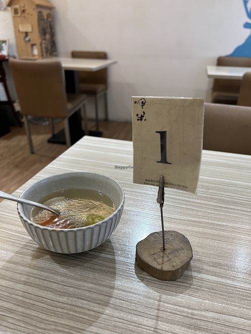 Complimentary soup and order number  at Rice Revolution 呷米 - Jiā Mǐ in Taipei