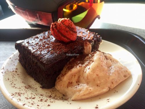 Delicious vegan brownie with coconut cream at Raven's Nest!  Yum! at Raven's Nest in Whistler