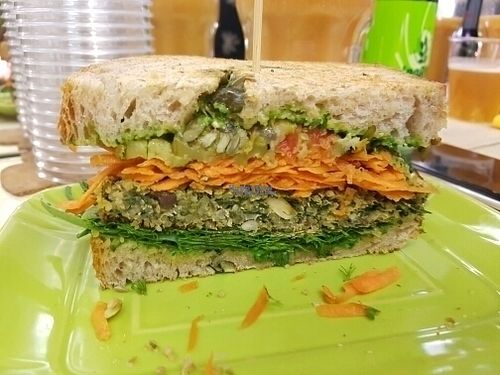 Vegan sandwich with a quinoa, olive and spinach patty at Rumi Bottega Organica in Rome