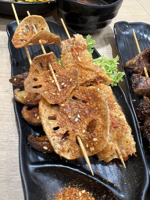 Upclose of the greasy “grilled” items  at Greendot 绿一点 - Paya Lebar in Central Singapore