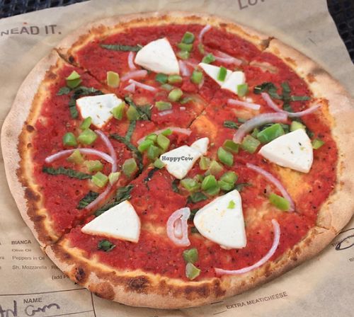 classic crust and sauce, vegan cheese, green bell pepper, red onion, basil toppings at Rise Pies in Boardman