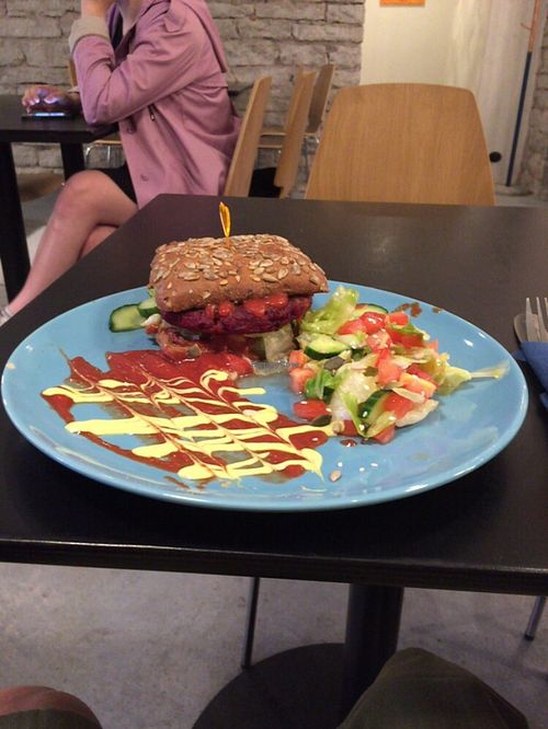 Beetroot burger with spicy tomato sauce, come with salad but chips are sold separately  at Vegan Inspiratsioon in Tallinn
