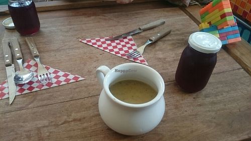 soup and chicha served in cute plates and cup at Centeno Restaurante Vegetariano in Medellin