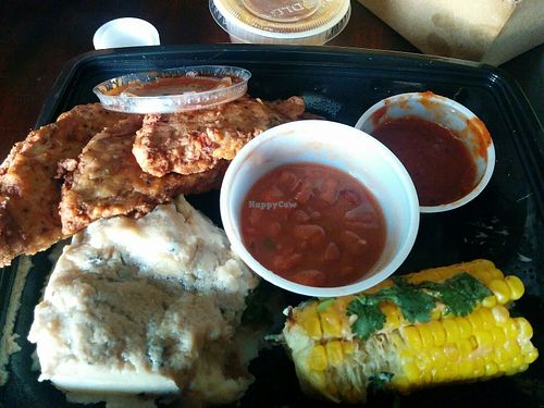 Ftom the summer menu. Backyard spicy fried chicken, cauli- mashed potatoes with porcini gravy, pinto beans stew, fresh roasted corn on the cob, BBQ sauce. Delicious! at Veggie Grill in Walnut Creek