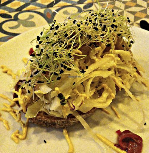 Toast with sauted cabbage, roasted onions and sprouts at VEGA - Luna in Madrid