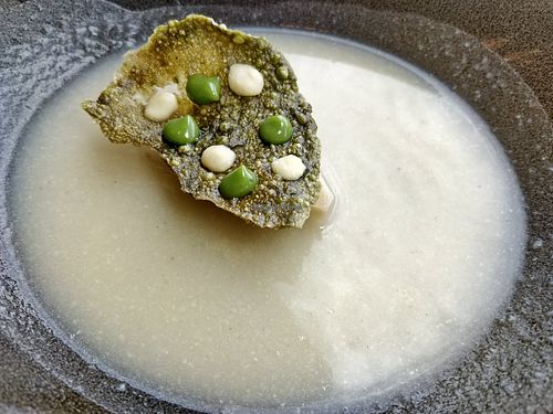 potato and cauliflower bisque with basil crisp at Joie Restaurant in Central Singapore