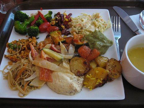Selection of cold and warm dishes. Soup on a separate bowl on the left. at Vaxt Cafe in Stockholm