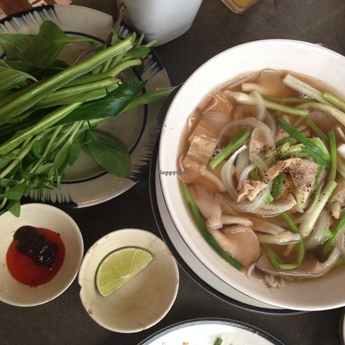 Pho with green stuff to mix in at Saigon Vegan - Bui Vien in Ho Chi Minh City