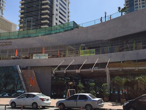 The restaurant terrace on the first floor next to other restaurants at Tidjoori Restaurant in Dubai