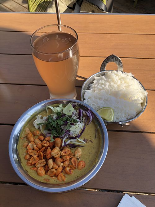 Peanut Tomato Curry with Lavender Kombucha  at Spork in Bend