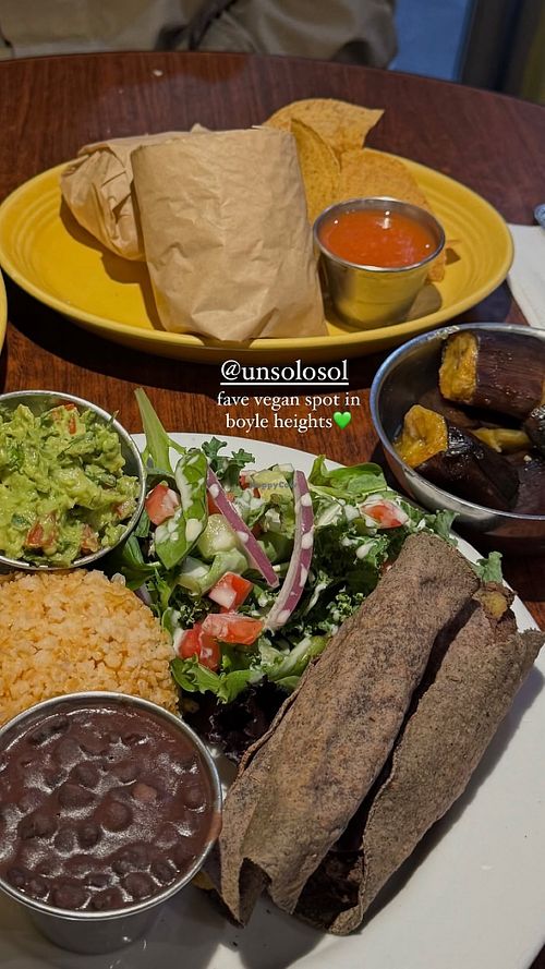 Taquitos Platter, baked plantains, & one of our many wraps  at Un Solo Sol in Los Angeles
