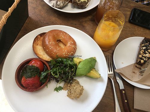 Bagel with tomato, avocado and hummus. Peanut cake.  at Scarecrow in Auckland