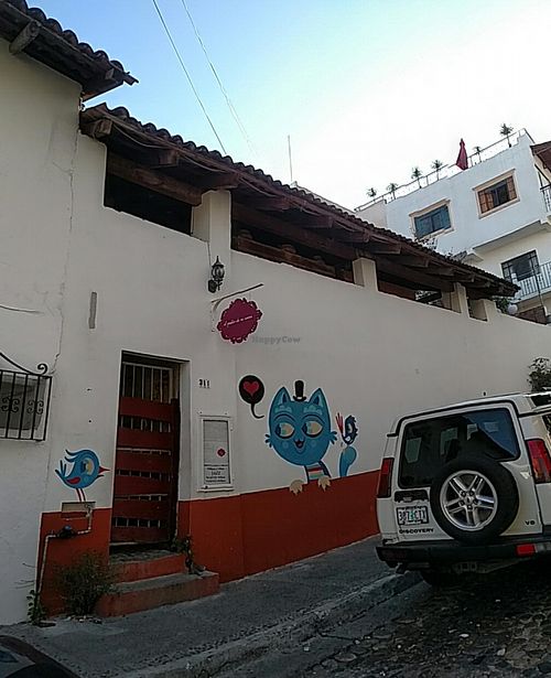 From the outside, the place looks quite small and almost abandoned during the day.
I used the panorama function on my smartphone so this view is a bit distorted, but it shows the roof structures, which is where the place is located. at El Patio de Mi Casa in Puerto Vallarta