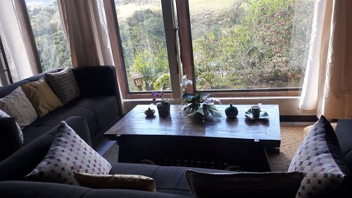 Living room with view on the Poas mountains at Puerta de Jade in Alajuela
