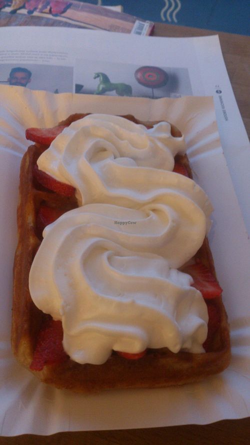 Vegan waffle with strawberries and coconut whipped cream at Sklep z Goframi in Warsaw