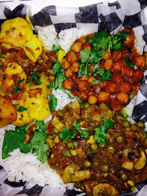 Mmmm chickpeas and rice come with your choice of 2 sides- all vegan. Yum! at Indigo in Washington