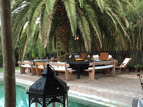 outside table under tree at Garzon Restaurant in Garzon