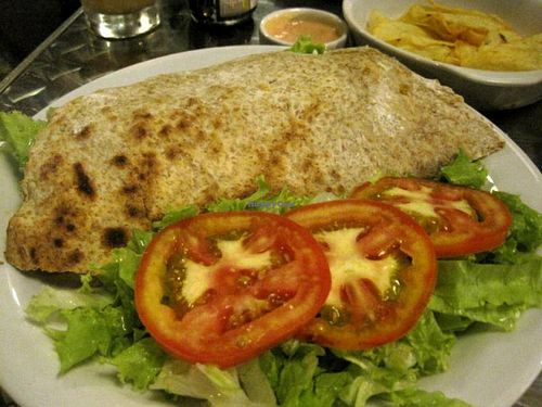 Gluten Sandwich. The gluten/seitan inside is amazing, I had never eaten a seitan like that. The sandwich was very good overall, although I'm not used to apples in savory sandwiches. I'd order it again though. at Vegetariano Social Clube Delivery in Rio De Janeiro