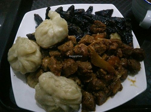Veggie dumplings, spicy soy and barbecue seitan with potatoes at 96 Zen Etterem in Budapest