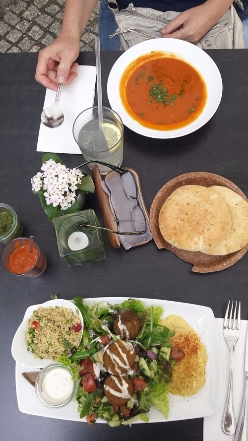 Hummus platted with tomato soup at Nanoosh in Berlin