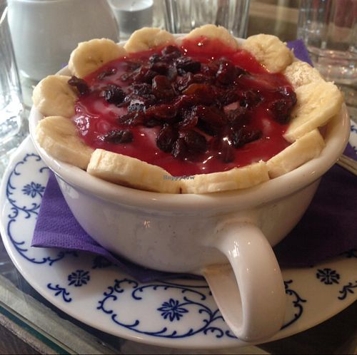 Raspberry porridge with banana and raisins at Sweet Secret of Raw in Prague