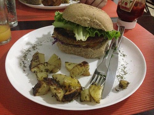 Quinoa burger with baked potatoes. at Barao Natural - B3 in Sao Paulo