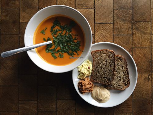 Thai sweet potato and pumpkin soup with freshly home backed bread, homemade hummus and pesto.  at Barkett in Berlin
