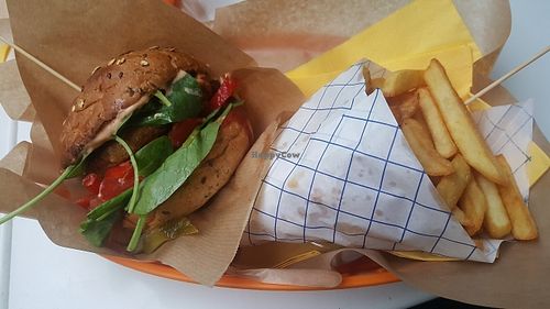 arabic burger. has spinich, tomatoes, red pepper, pickles and onions at Mango Vegan Street Food - Bracka in Warsaw