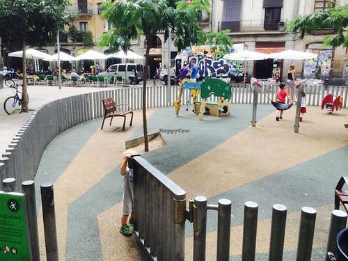 Playground out front.  Cafe's outdoor seating can be seen to the upper left. at Vegetalia - Gotico in Barcelona