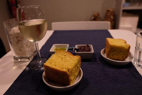 Focaccia with olive paste and EVOO... and wine. at Lupin Restaurante Vegetariano in Porto