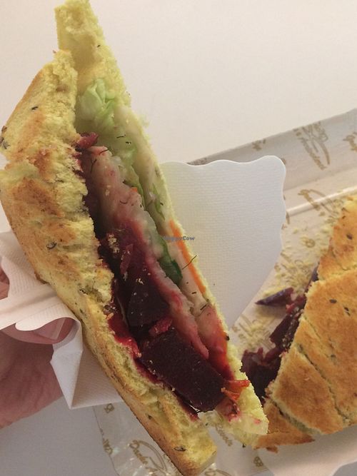 Vegan sandwich with beetroot, salad, sweetpotatoes, carrots and turmeric bread at Brunchy Bar in Padua